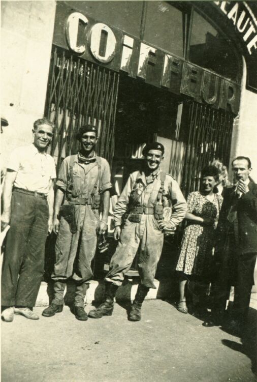 Paris 25 Aug 1944. Stood for a free haircut. Louis Michard on the right.